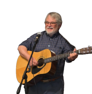 Randy Cahall playing acoustic guitar with a microphone.